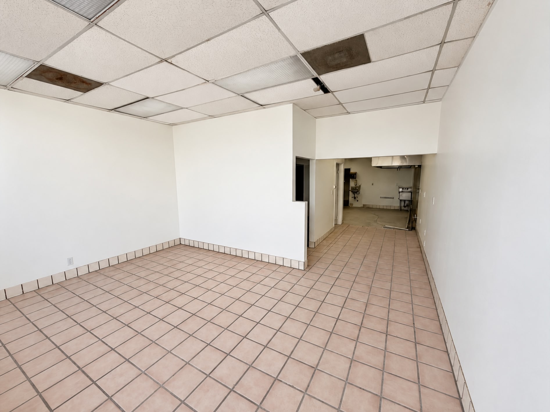 Open suite interior with tile flooring