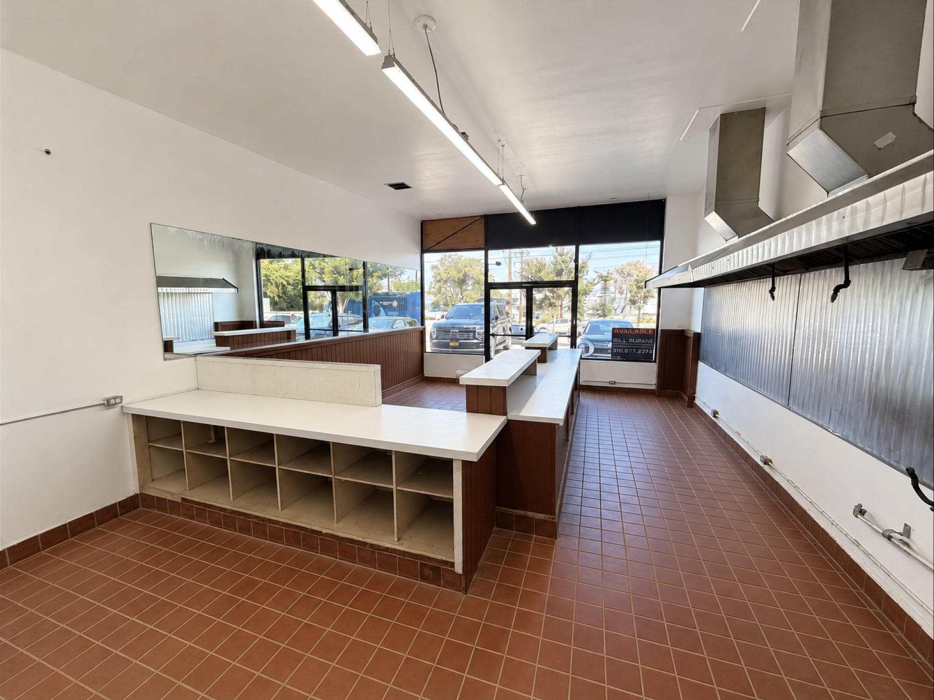 Front service area with existing counters and storefront glazing